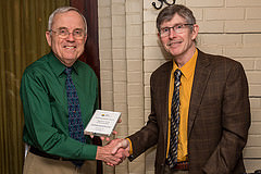 Myron Reese receiving award from Jim O'Brien