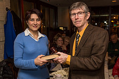 Pegah Jalili receiving the book and gavel from Jim O'Brien