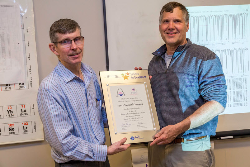 Jerry Jost (right) receives the Salute to Excellence plaque from Jim O’Brien
