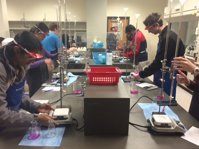 Titrators busily and competitively doing what titrators do