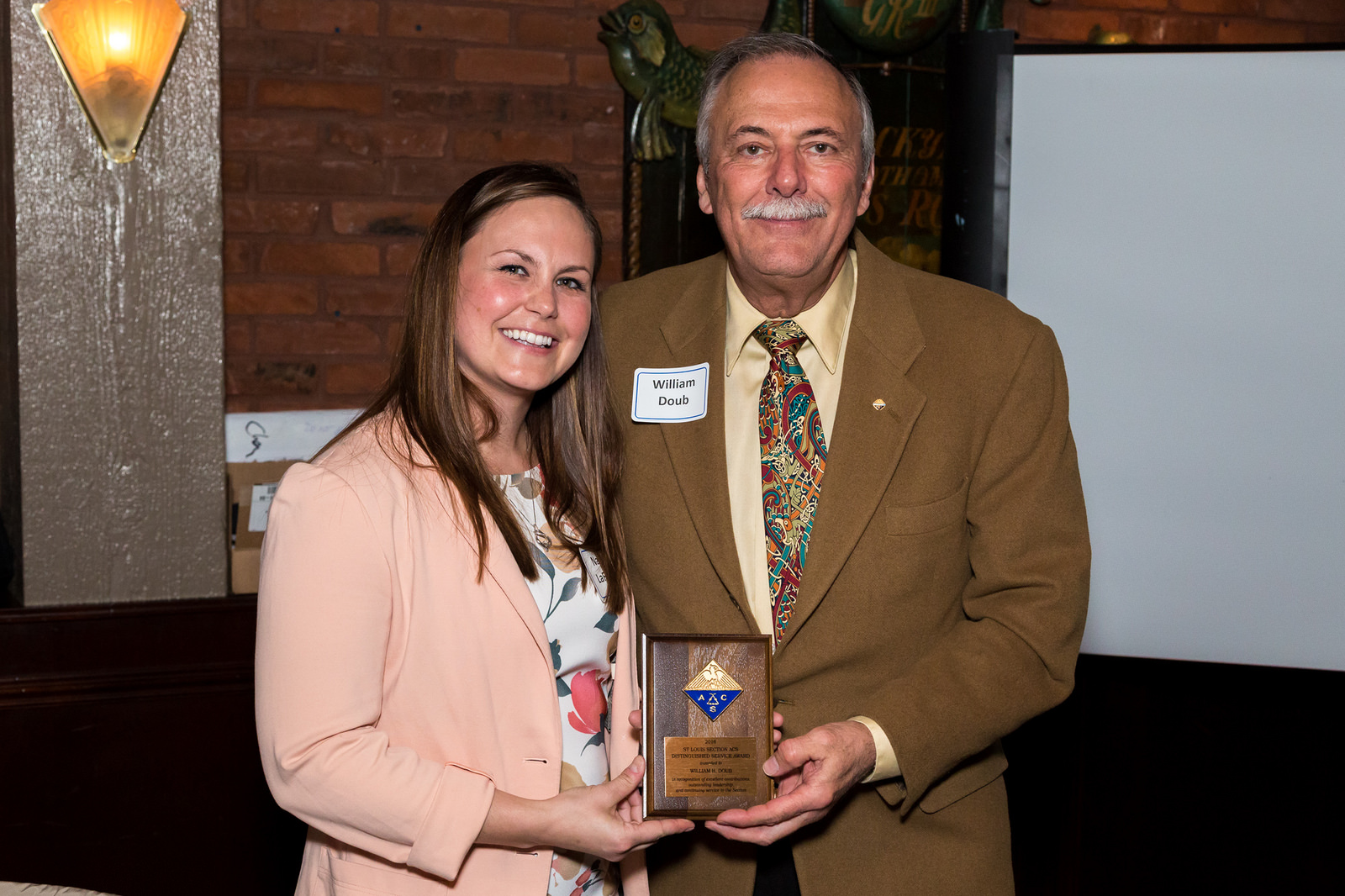 Bill Doub receives the Distinguished Service Award from Chair-Elect Natalie LaFranzo