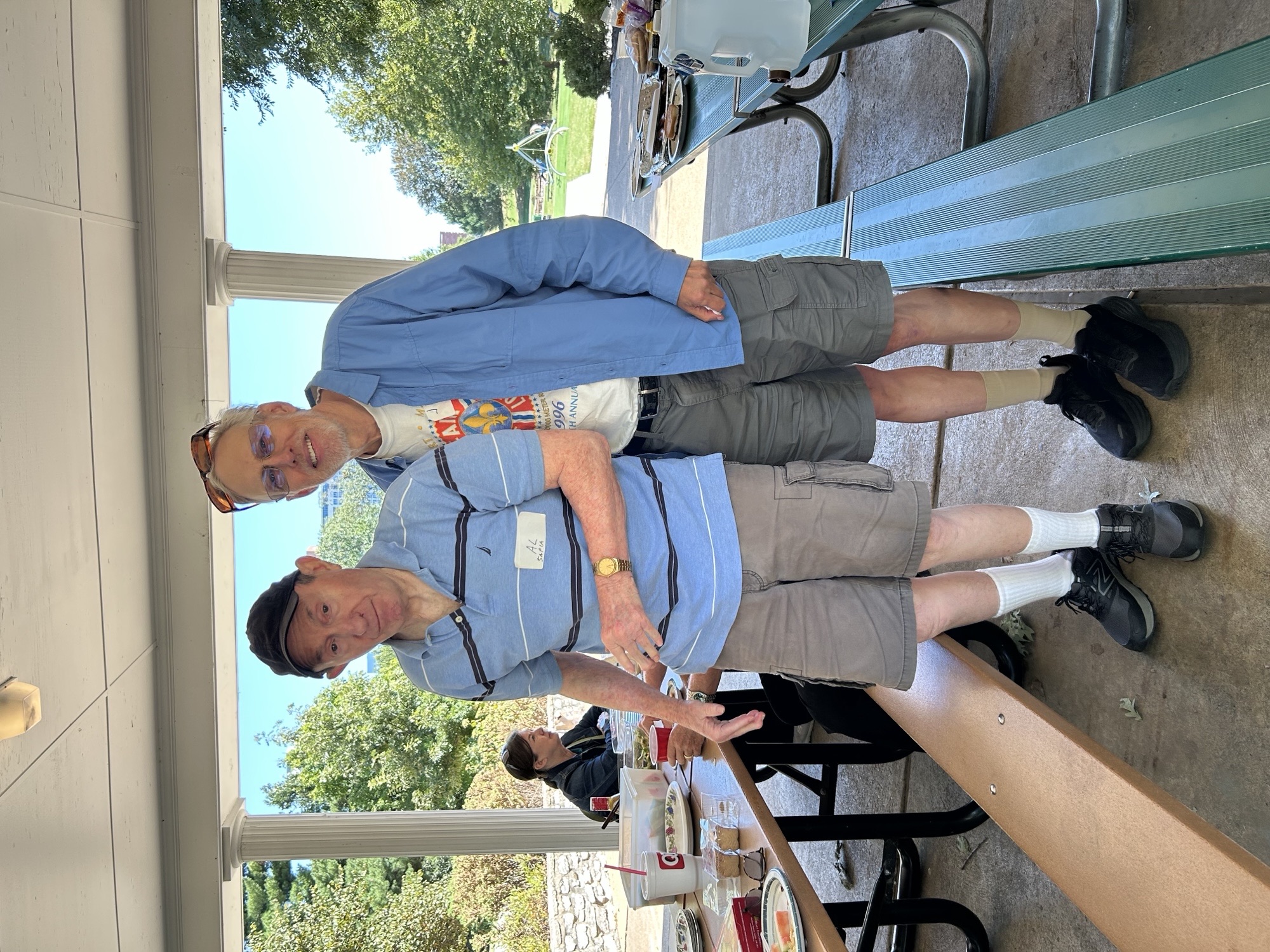 Two People posing in a park pavilion