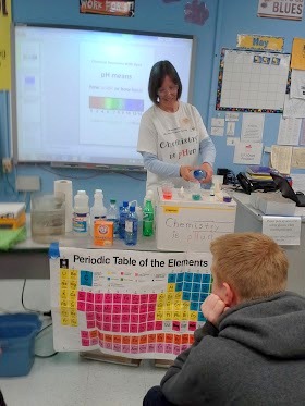 Amy Kerkenmeyer doing the pH testing during the Chemistry is pHun program for eighth graders