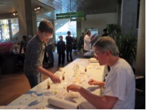 Sam Tadrus is helped by Chris Glass to do the Starch Scavenger Hunt at the St. Louis Science Center for National Chemistry Week on 8/26/13.