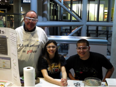 Don Sartor, Marisa Gonzalez, and Daniel Gutierrez pause from Crushing Cans at the Kids and Chemistry at the Saint Louis Science Center for Chemists Celebrate Earth Day on 4/18/15.
