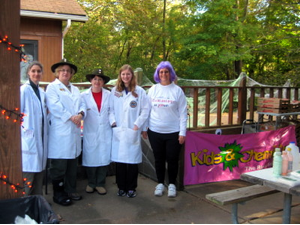 Lisa Balbes , Teresa Colletti, Sophie Craft, Rachael Craft, and Sheryl Loux pause before making “Gluep” at the Cub Scouts’ “Fright Fest” on October 10, 2015.